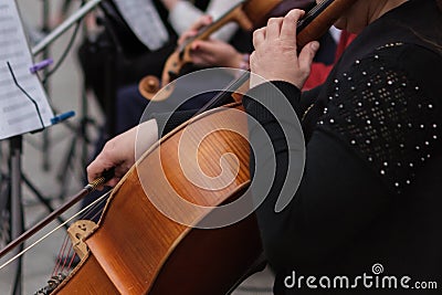 Zhytomyr, Ukraine - May 15, 2021: man street musician playing cello classical music Stock Photo