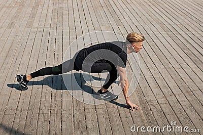 Man stretching leg doing sports Stock Photo