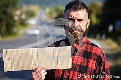 Man with strict face and beard travelling by hitchhiking Stock Photo