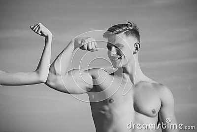 Mens heals body care. Man with strong hand biceps, triceps smile at female hand Stock Photo