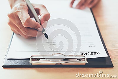 Man submit resume to employer to review job application. Stock Photo