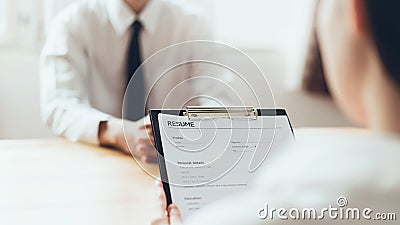 Man submit resume to employer to review job application. Stock Photo