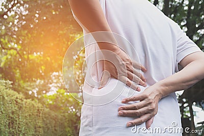 A man suffering from backache, spinal injury and muscle issue Stock Photo