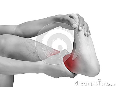 Man suffering from cramp using hand massage painful foot Stock Photo