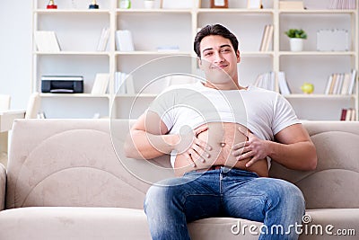 The man suffering from extra weight in diet concept Stock Photo