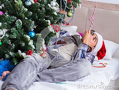 Man suffering hangover after christmas party Stock Photo