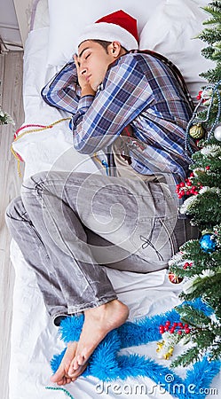 Man suffering hangover after christmas party Stock Photo