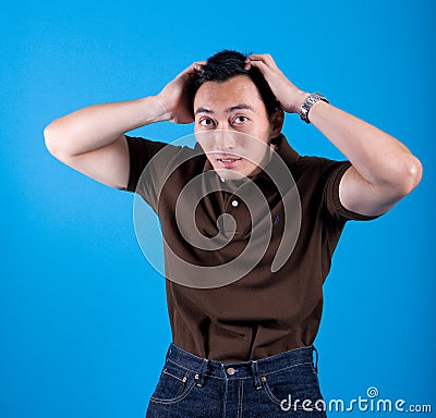 Man suffering from itchy scalp Stock Photo