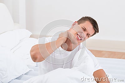 Man Suffering From Neckache Stock Photo