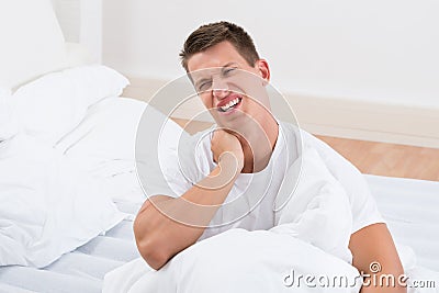 Man Suffering From Neckache Stock Photo