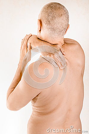 Man suffering of thoracic vertebrae or trapezius muscle pain Stock Photo