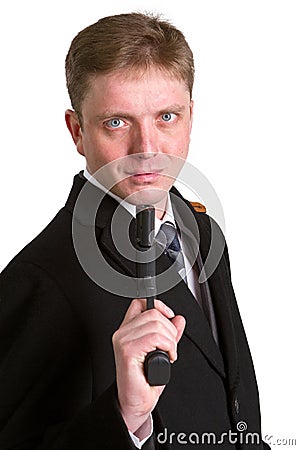 Man in a suit aims from a pistol Stock Photo