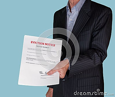 Man in suit giving eviction notice to renter or tenant of home Stock Photo
