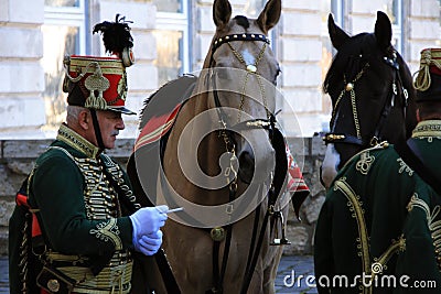 A man in a suit hussar and two horses Budapest Editorial Stock Photo