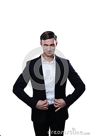 Man in a suit straightens his jacket Stock Photo