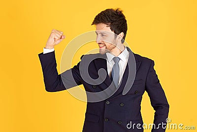 A man in a suit with a tie Handsome looking face with beard In Mad Look, business people are happy by raising their hands to raise Stock Photo