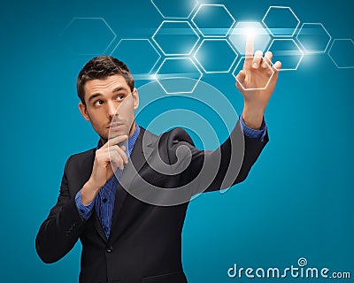 Man in suit working with virtual screens Stock Photo