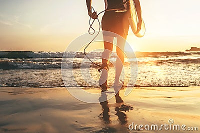 Man surfer runing in ocean with surfboard. Close up legs image at Weligama beach,Sri Lanka Stock Photo