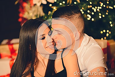 Man surprise woman for Chrismas, loving couple Stock Photo