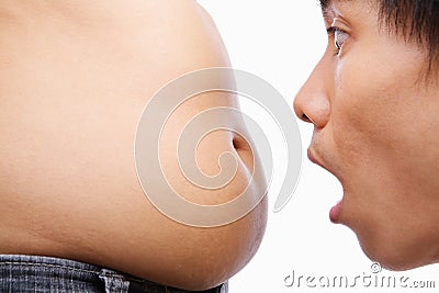 Man surprised looking on big belly Stock Photo