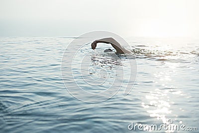 A man swimming for exercise in at swimming pool Stock Photo