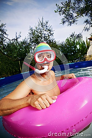 Man swimming in a portable swimming pool Stock Photo