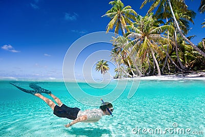 Man swimming underwater Stock Photo