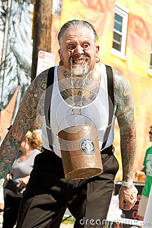 Man Swings Bucket Of Bricks Using Eyelids In Freak Show Editorial Stock Photo