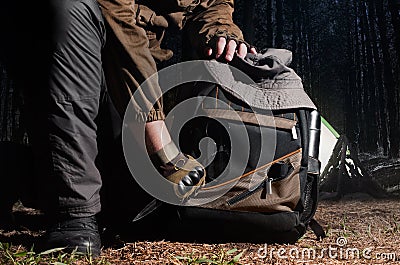 Camping tactical gear in woods. Stock Photo