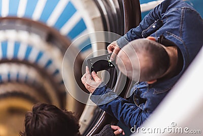 Man take photo old blue spiral staircase, spiral stairway inside an old house in Budapest, Hungary. Project Budapest 100 Editorial Stock Photo