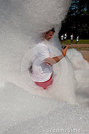 Man Takes Selfie Standing In Soap Suds At Bubble Palooza Editorial Stock Photo