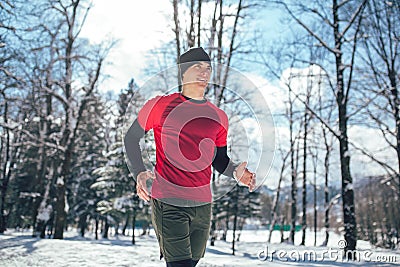 Man Taking Break From Running in Extreme Snow Conditions Stock Photo