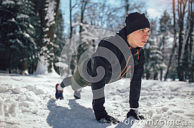 Man Taking Break From Running in Extreme Snow Conditions Stock Photo