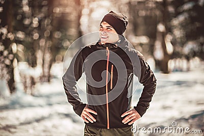 Man Taking Break From Running in Extreme Snow Conditions Stock Photo