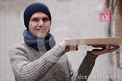Man taking an item in a store Stock Photo