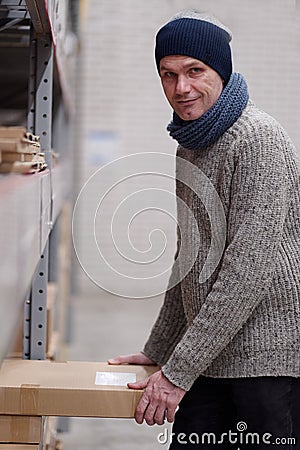 Man taking an item in a store Stock Photo