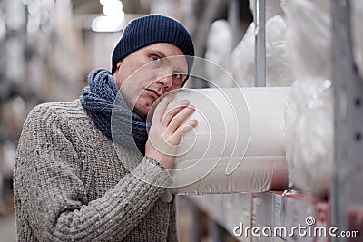 Man taking an item in a store Stock Photo