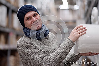 Man taking an item in a store Stock Photo