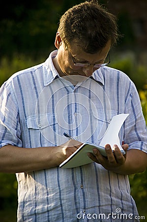 Man taking notes Stock Photo
