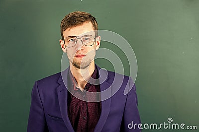 Man teacher wear eyeglasses for vision green chalkboard background, intelligent guy concept Stock Photo