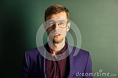 Man teacher wear eyeglasses for vision green chalkboard background, september concept Stock Photo