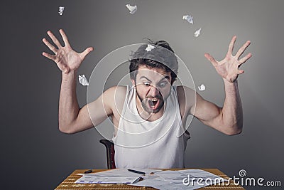 Man tearing apart bills Stock Photo