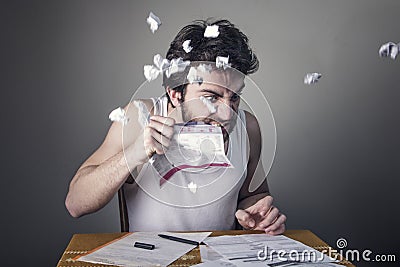 Man tearing apart bills Stock Photo