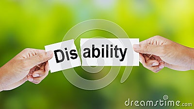 Man tearing the word Disability for Ability Stock Photo