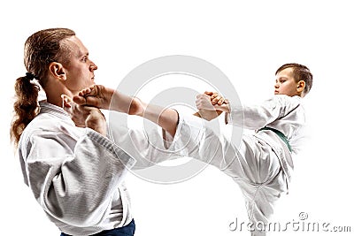 Man and teen boy fighting at aikido training in martial arts school Stock Photo
