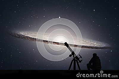 Man with telescope looking at the stars. Sombrero Galaxy M104 Stock Photo