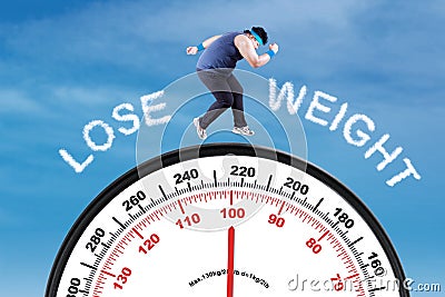 Man with text lose weight and scale Stock Photo