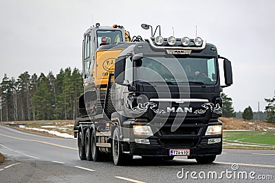 MAN TGS 35.540 Truck Hauls Excavator Editorial Stock Photo