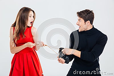 Man theif stealing young woman bag Stock Photo