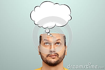 The man thought about it, a sketch of the Cloud Bubble hangs over his head. The concept of dreams, thoughts, idea. Close-up Stock Photo